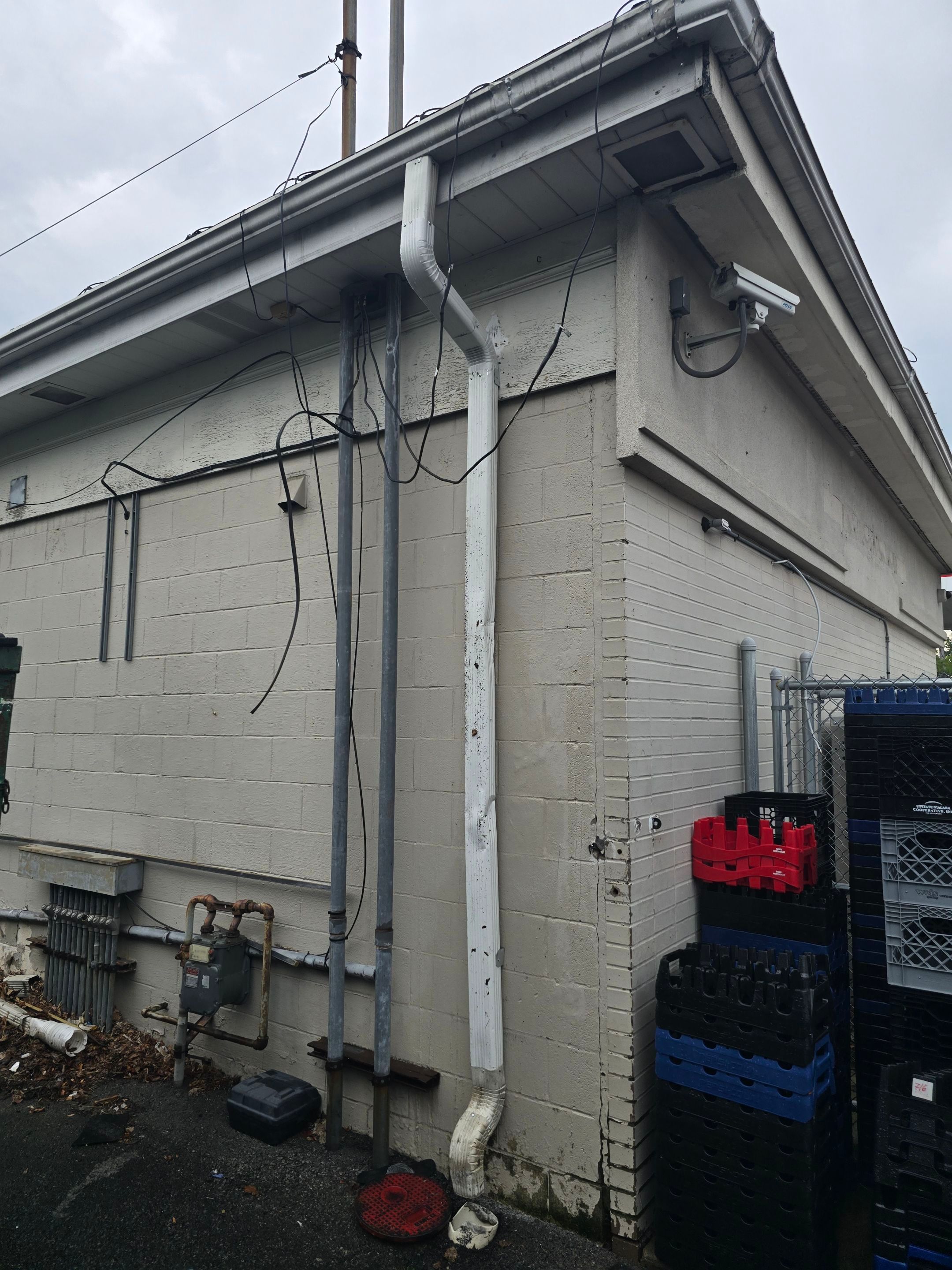 Reconnected downspout at a Kenmore-area commercial building.